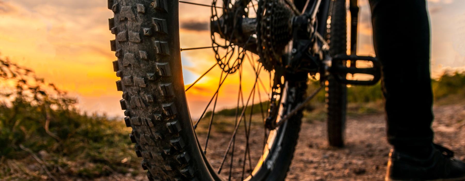 a person standing next to a bicycle