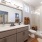 bathroom with mirror and walk in shower