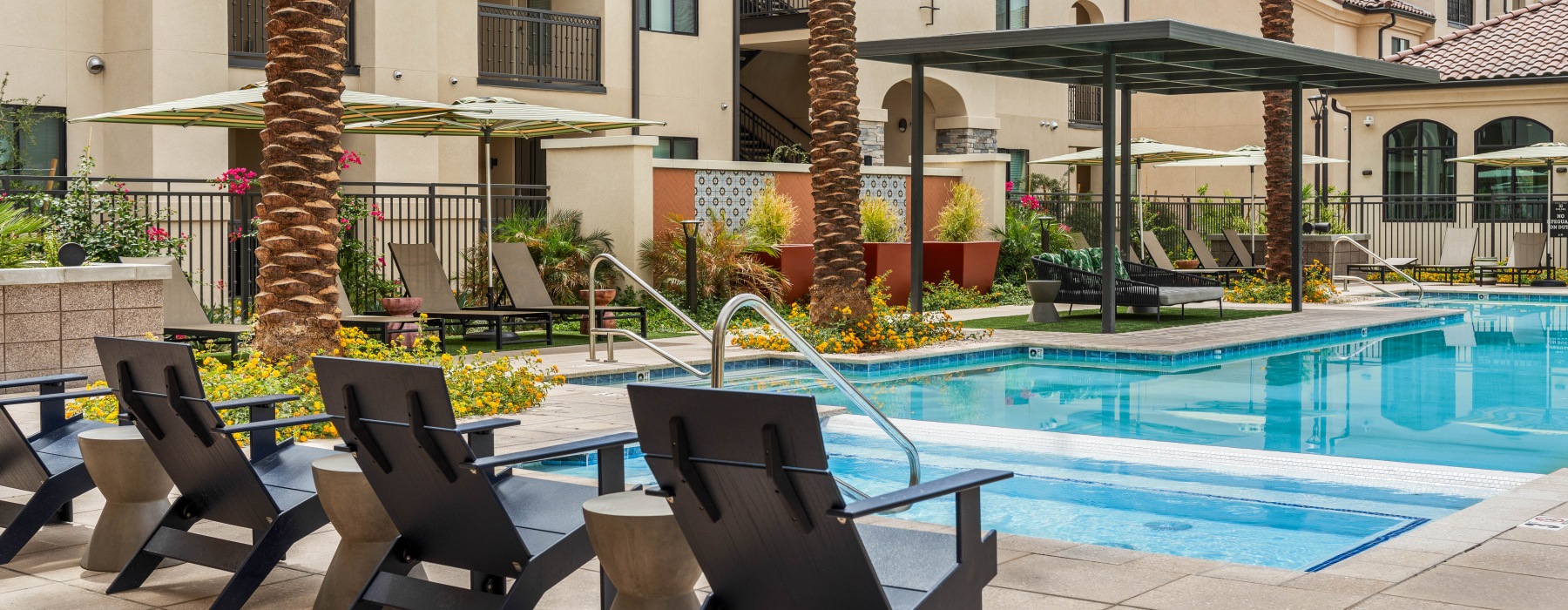 lounge chair seating next to pool and spa