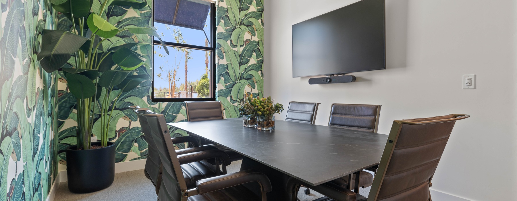 conference room with seating and television