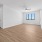 living room with wood flooring and a window
