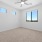 bedroom with carpet and windows