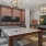 Apartments in South Phoenix, AZ for Rent - Solara Vista - Clubhouse with a Billiards Table, Chandeliers, and Mounted Televisions