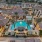 Expansive Resort-Style Pool Surrounded By Lounge Seating and Large Palm Trees| Solara Vista Luxury Apartments in Phoenix, AZ 