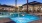 Expansive Resort-Style Pool and Spa Surrounded By Lounge Seating and Large Palm Trees| Solara Vista Luxury Apartments in Phoenix, AZ 