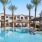 Resort-style swimming pool with lounge seating